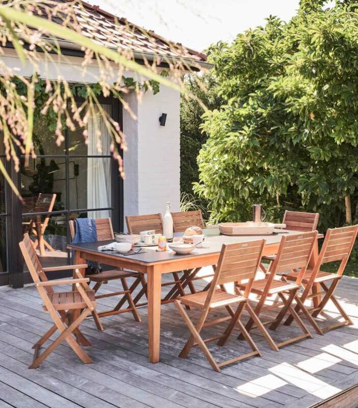 Mesa de jardín extensible de madera de eucalipto FSC® y piedra 180/240x90 cm y 8 sillas plegables